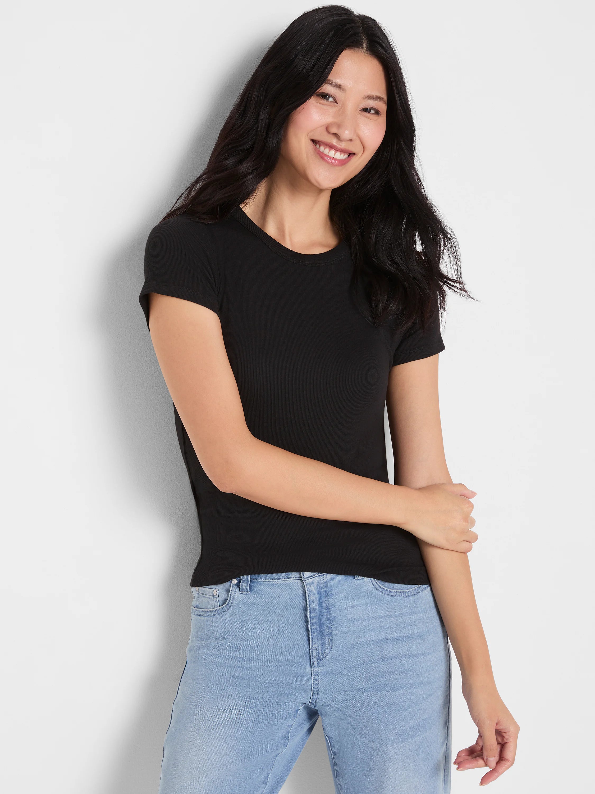 Black ribbed knit short sleeve crew neck tee, form-fitting.