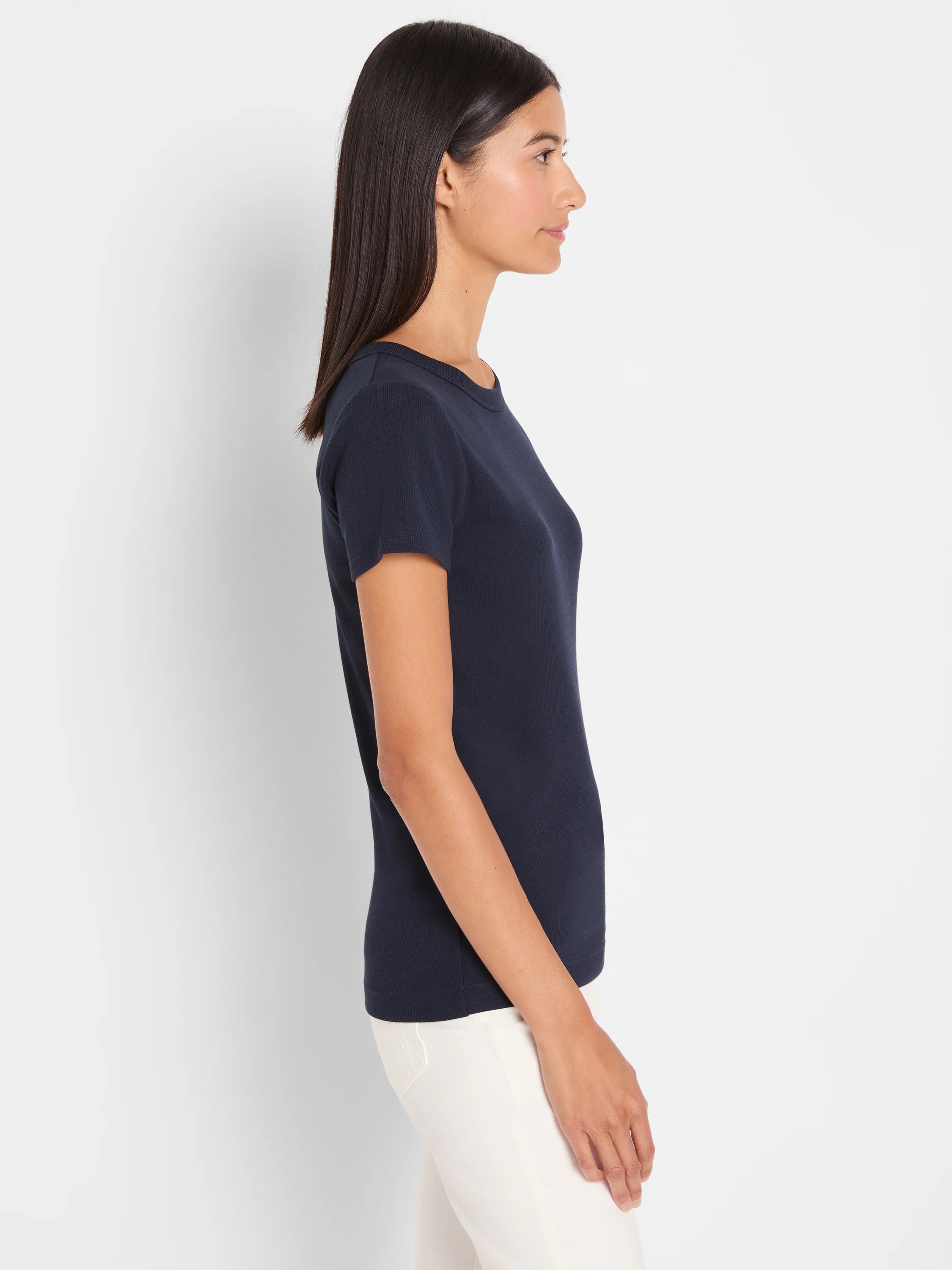 Fitted navy blue rib knit short sleeve crew neck tee shown on a model.