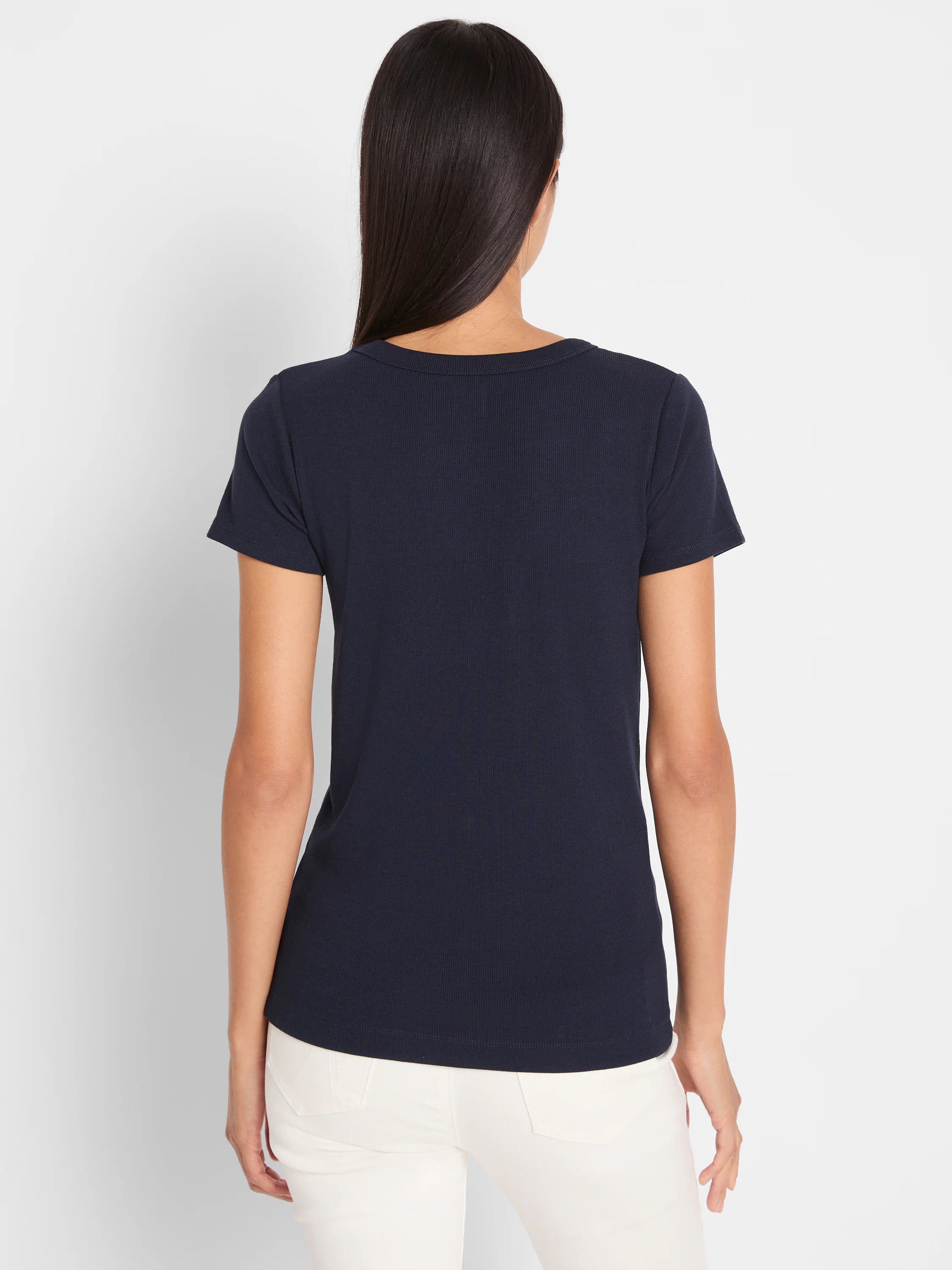 Dark navy ribbed knit short sleeve tee, seen from behind on a model. Features a crew neck and close fit.