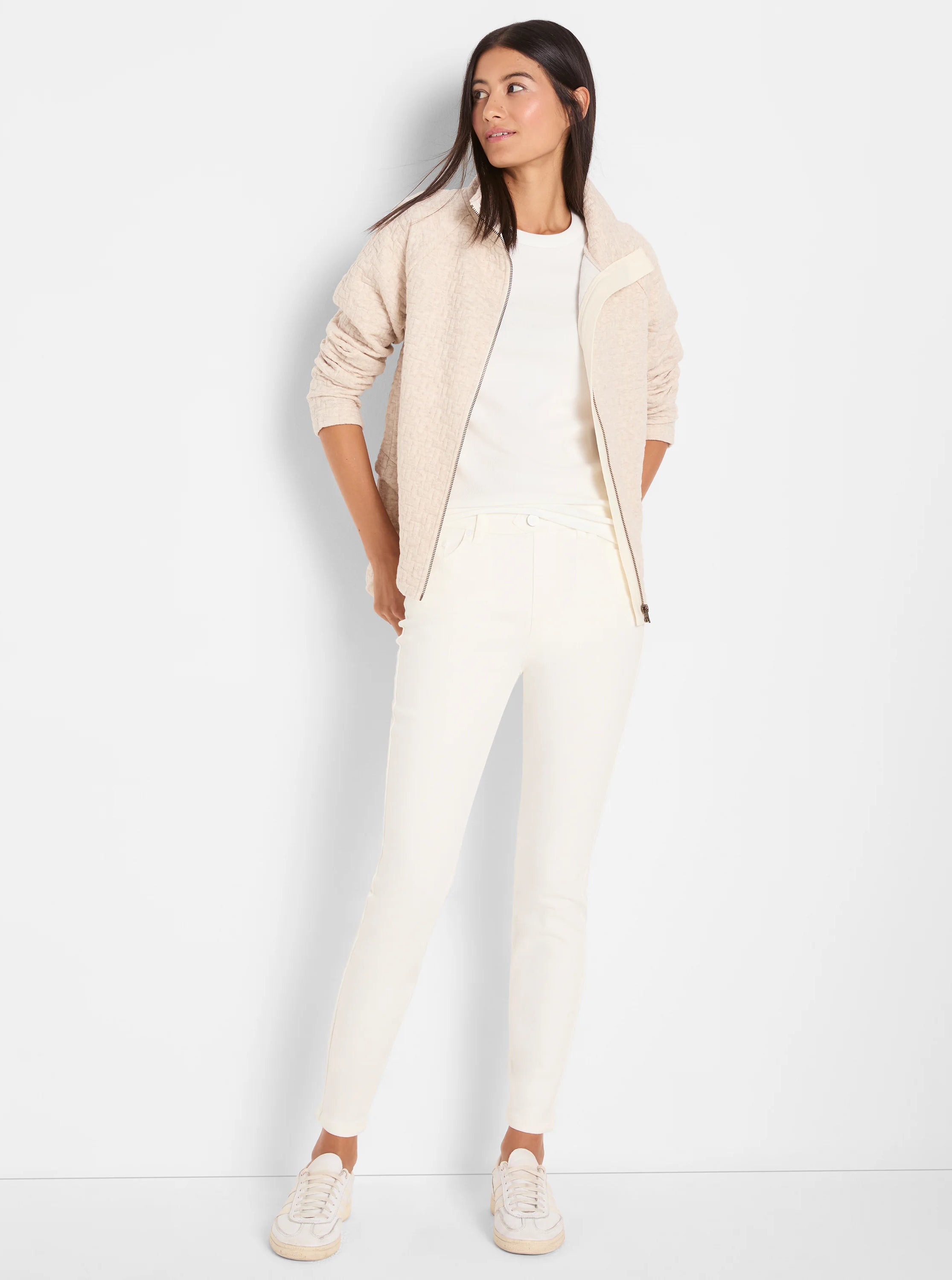 White ribbed knit short sleeve crew neck tee, worn under an open jacket.