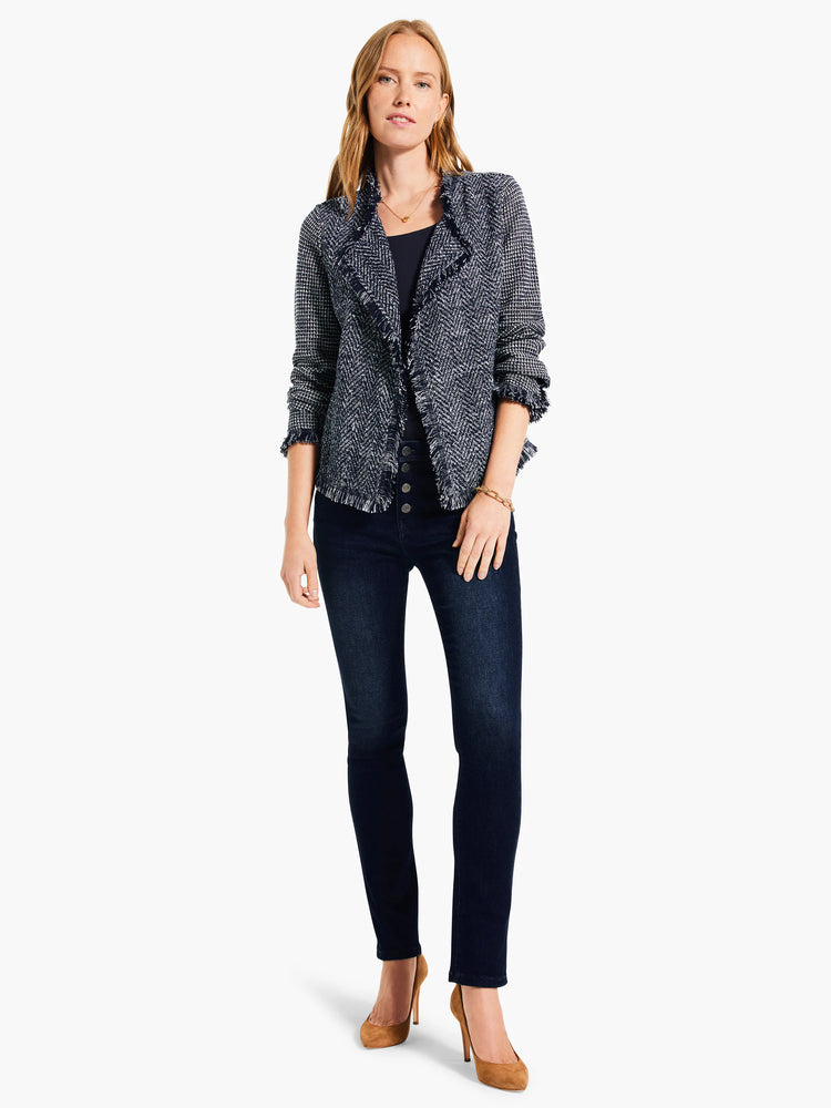 Dark navy scoop neck tank top with a smooth appearance, partially visible under a jacket.