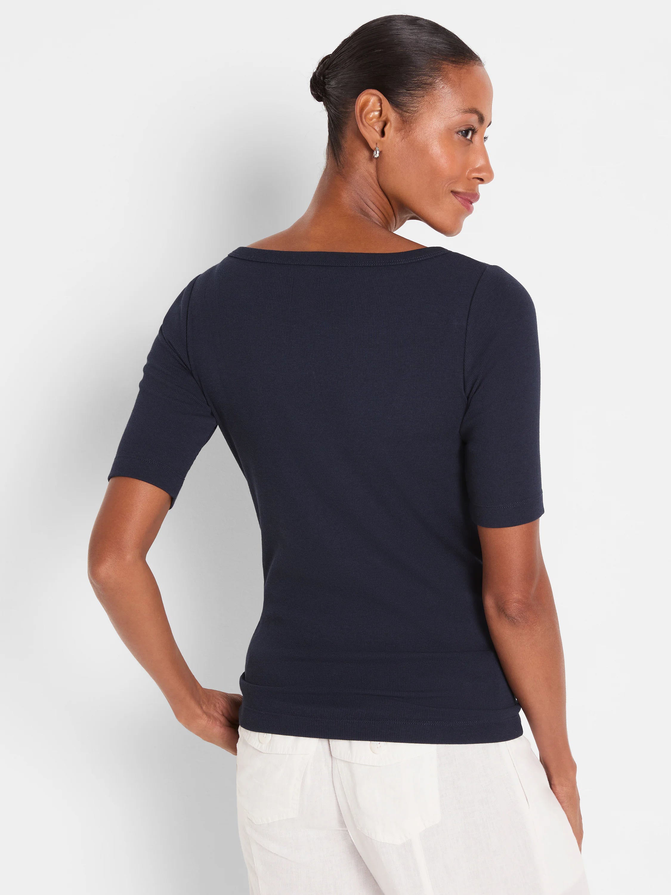 Navy ribbed elbow-sleeve boatneck tee, fitted, worn by model from behind.