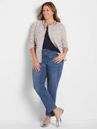 Dark navy ribbed knit scoop tank, partially visible under a light jacket.