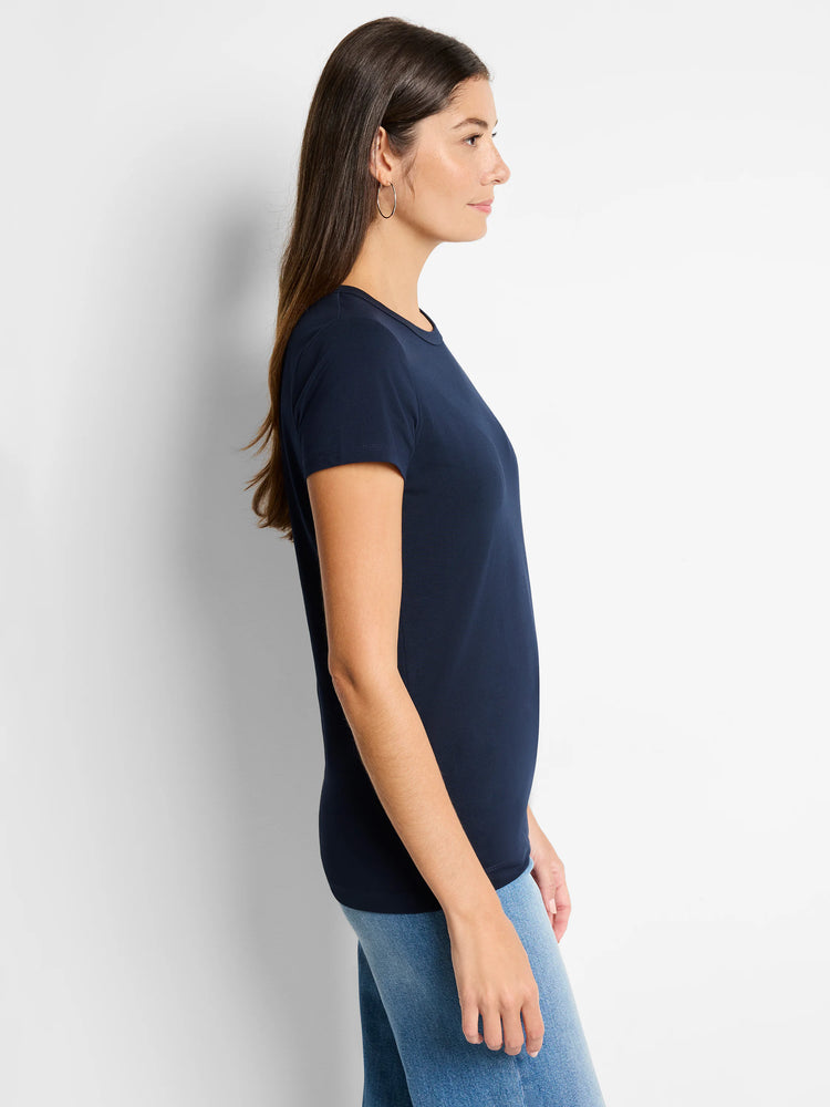 A navy knit crew neck t-shirt with short sleeves, worn by a woman in profile.