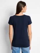 Back view of a model in a dark navy blue short-sleeved crew neck t-shirt.