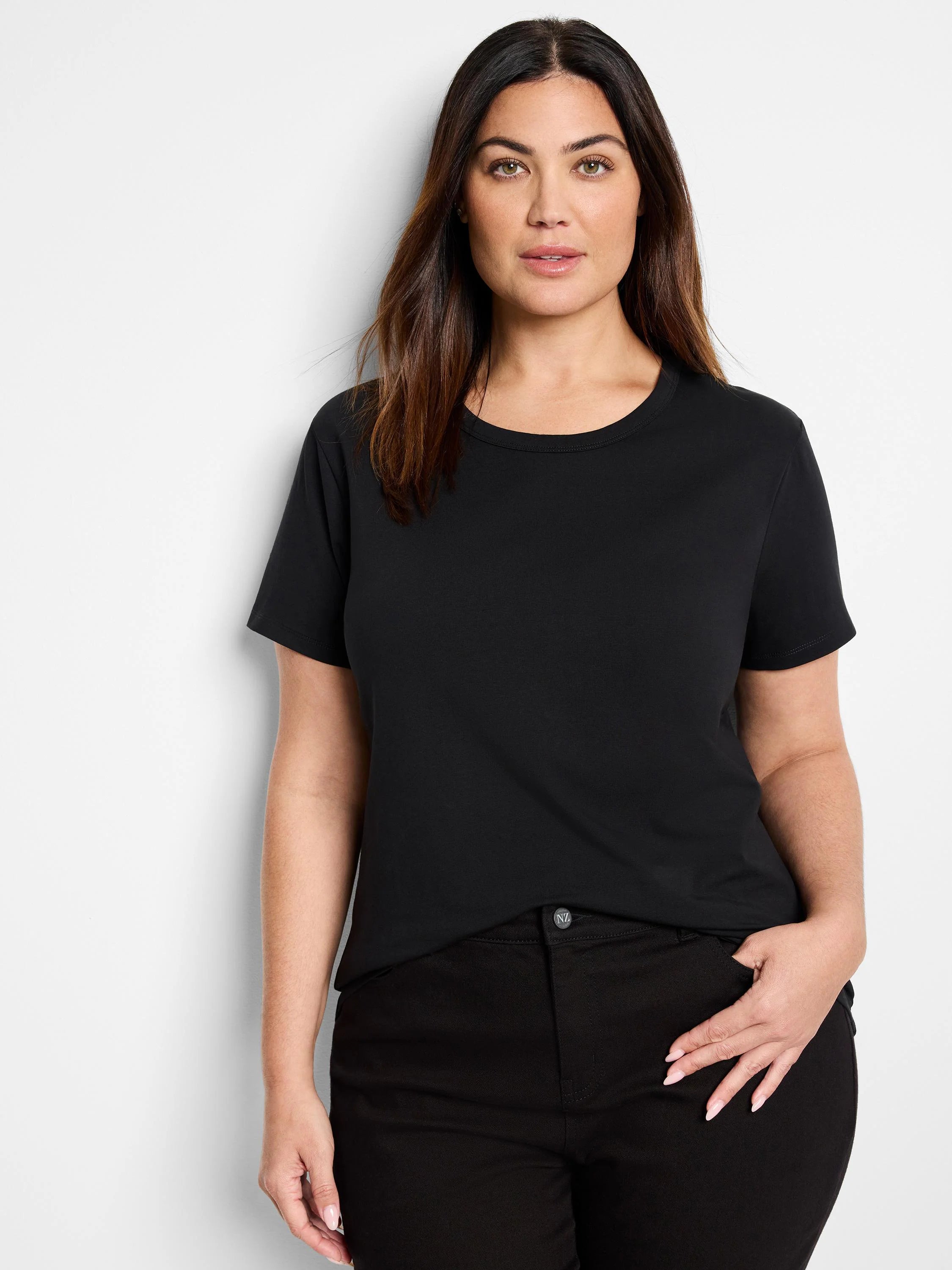 Model wears a black, short-sleeve crew neck t-shirt.
