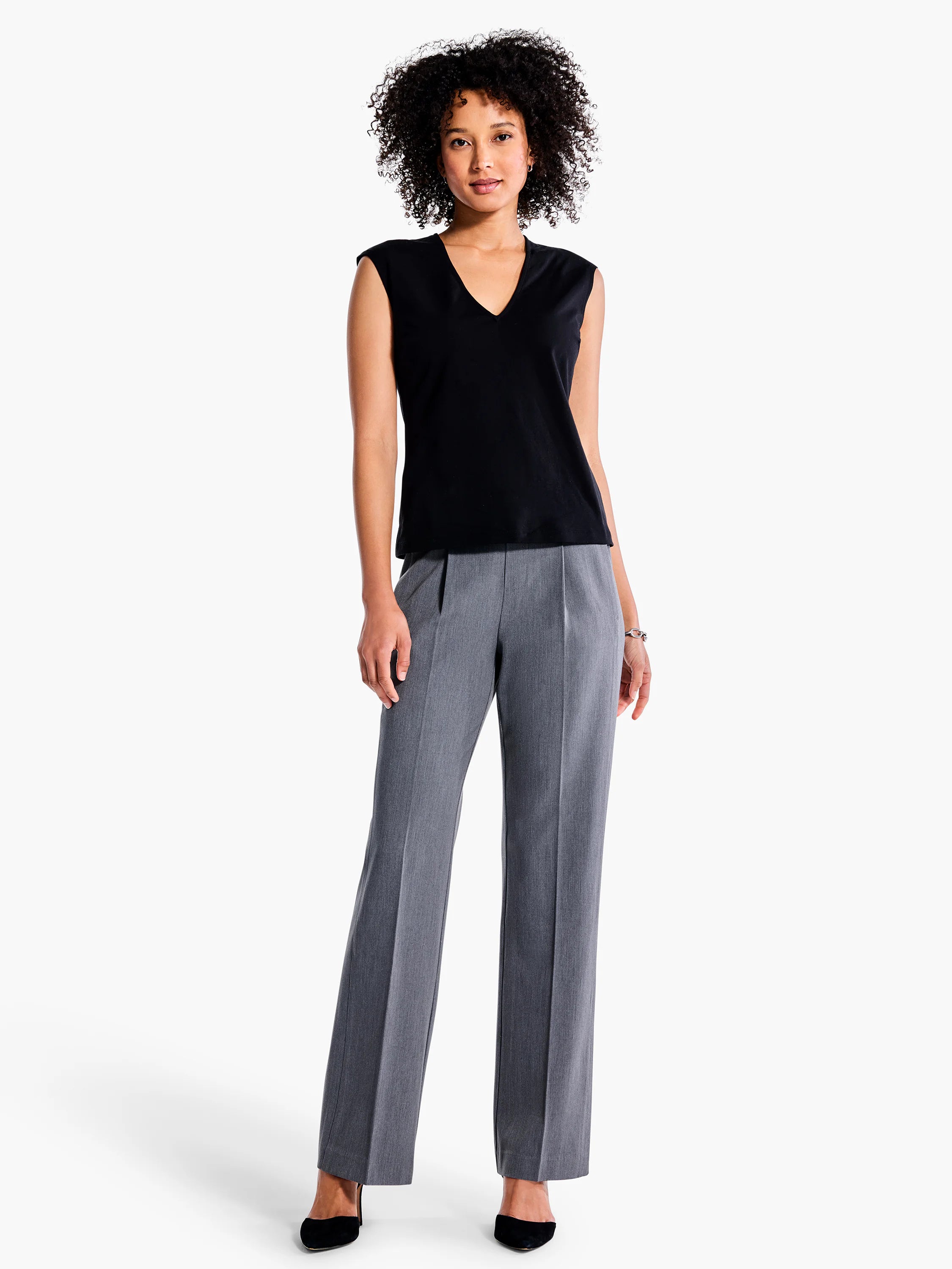 Black sleeveless V-neck top; gray straight-leg pants. Model shown.