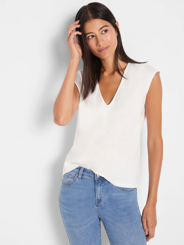 Off-white V-neck top featuring cap sleeves and a smooth, flowing fabric texture.