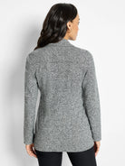 Grey marled knit blazer, rear view. Speckled texture, long sleeves, and a visible collar.