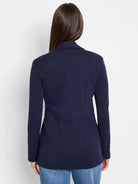 Navy knit blazer, back view. Features a back yoke seam, cinched waist band, and long sleeves.