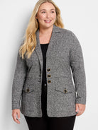 Grey marl knit blazer with notched lapels, 3 gold-rimmed black buttons, and 2 buttoned patch pockets.