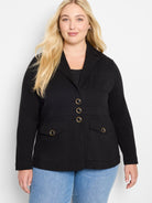 Black knit blazer with lapels. Features 3 gold-accented buttons, 2 chest pockets, & 2 lower flap pockets.