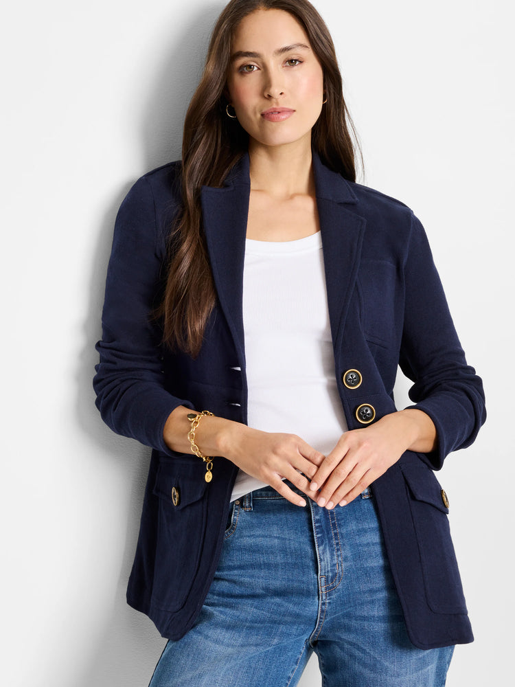 Dark blue knit blazer with lapel collar. Features gold-rimmed black buttons on pockets and cuffs.