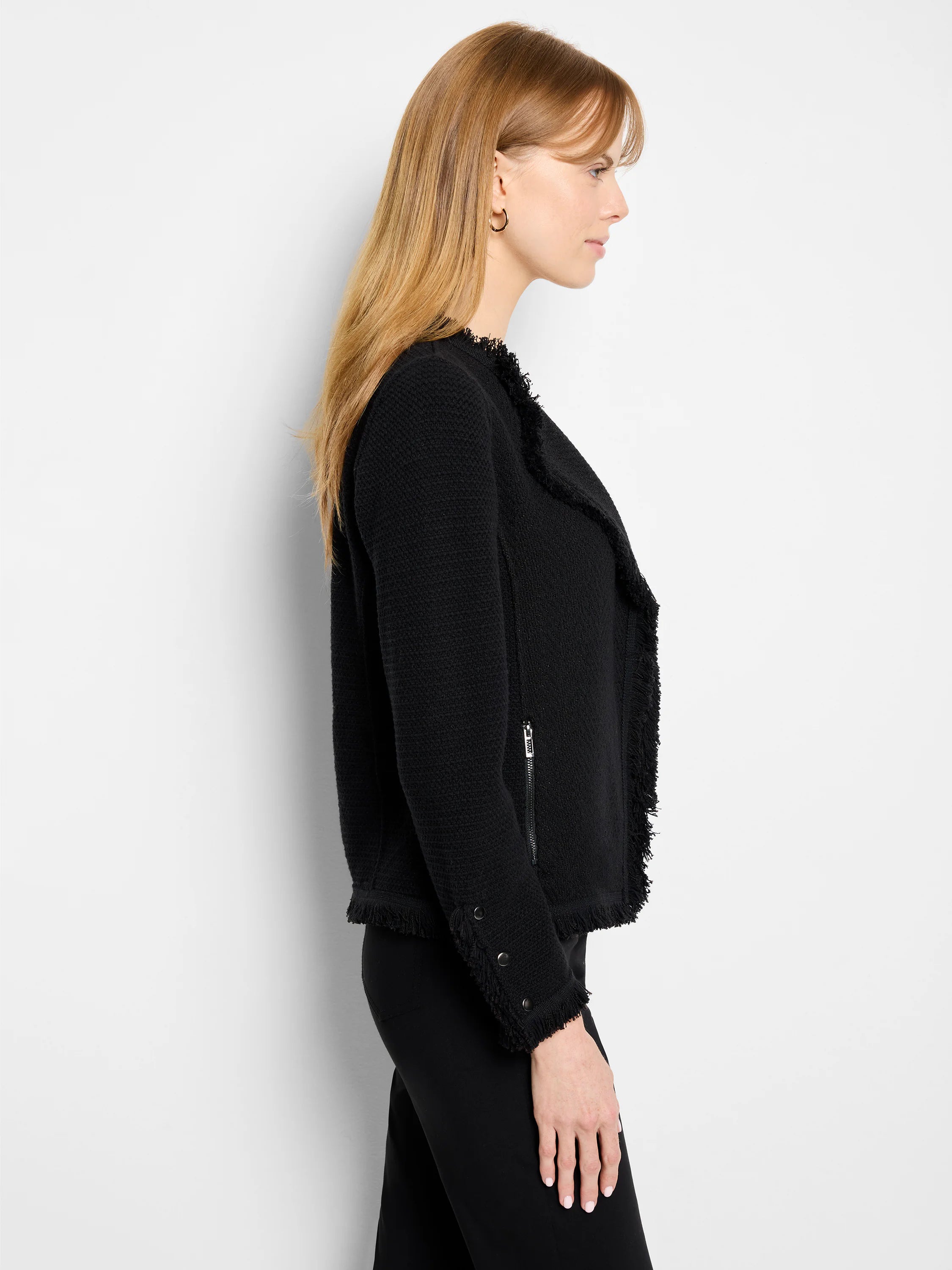 Black knit jacket with fringe on front, cuffs, and hem. Silver zipper pocket, two silver cuff snaps.