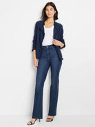 Dark blue knit jacket with fringe trim along its open front, neckline, cuffs, and hem.