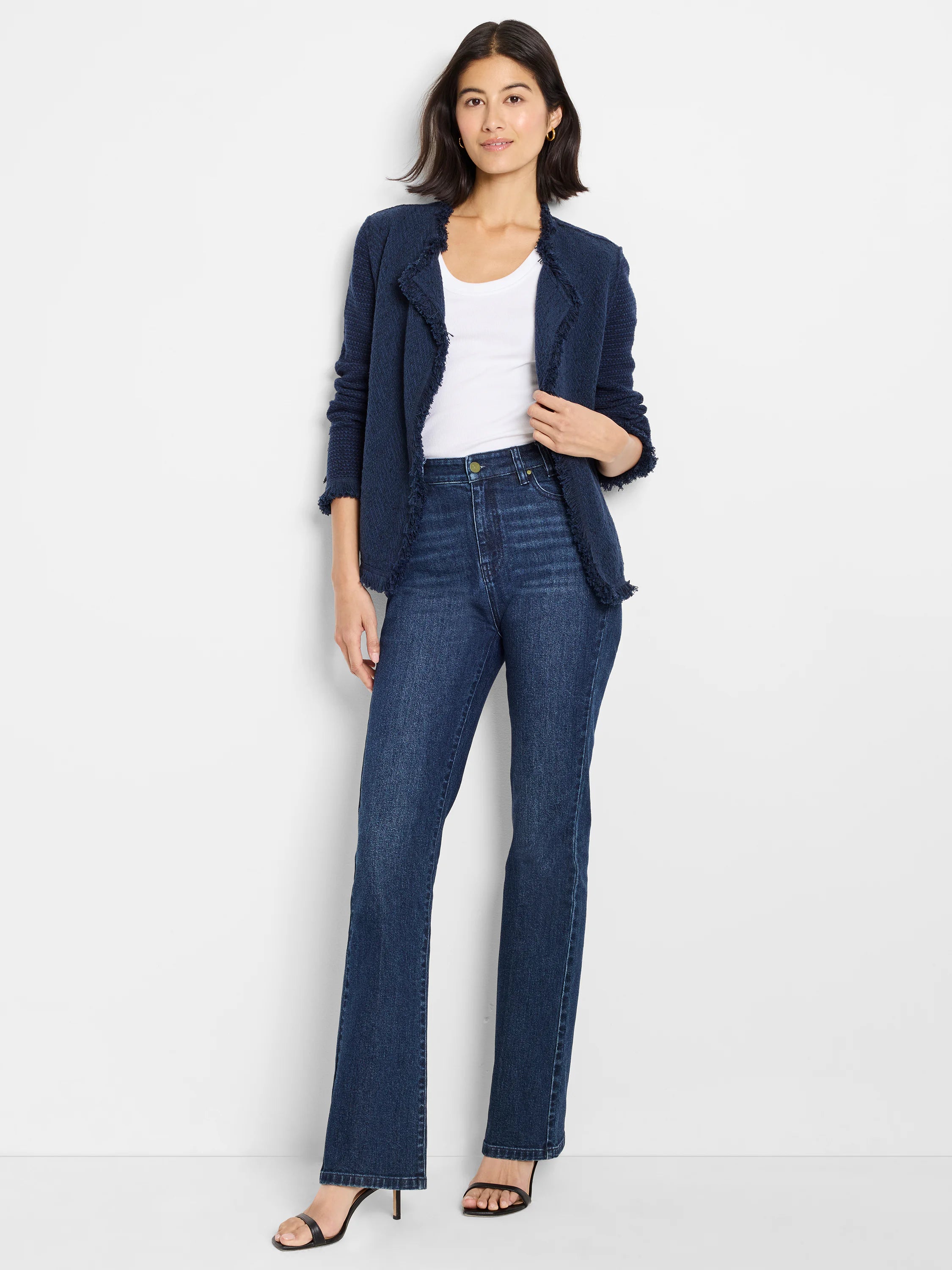 Dark blue knit jacket with fringe trim along its open front, neckline, cuffs, and hem.