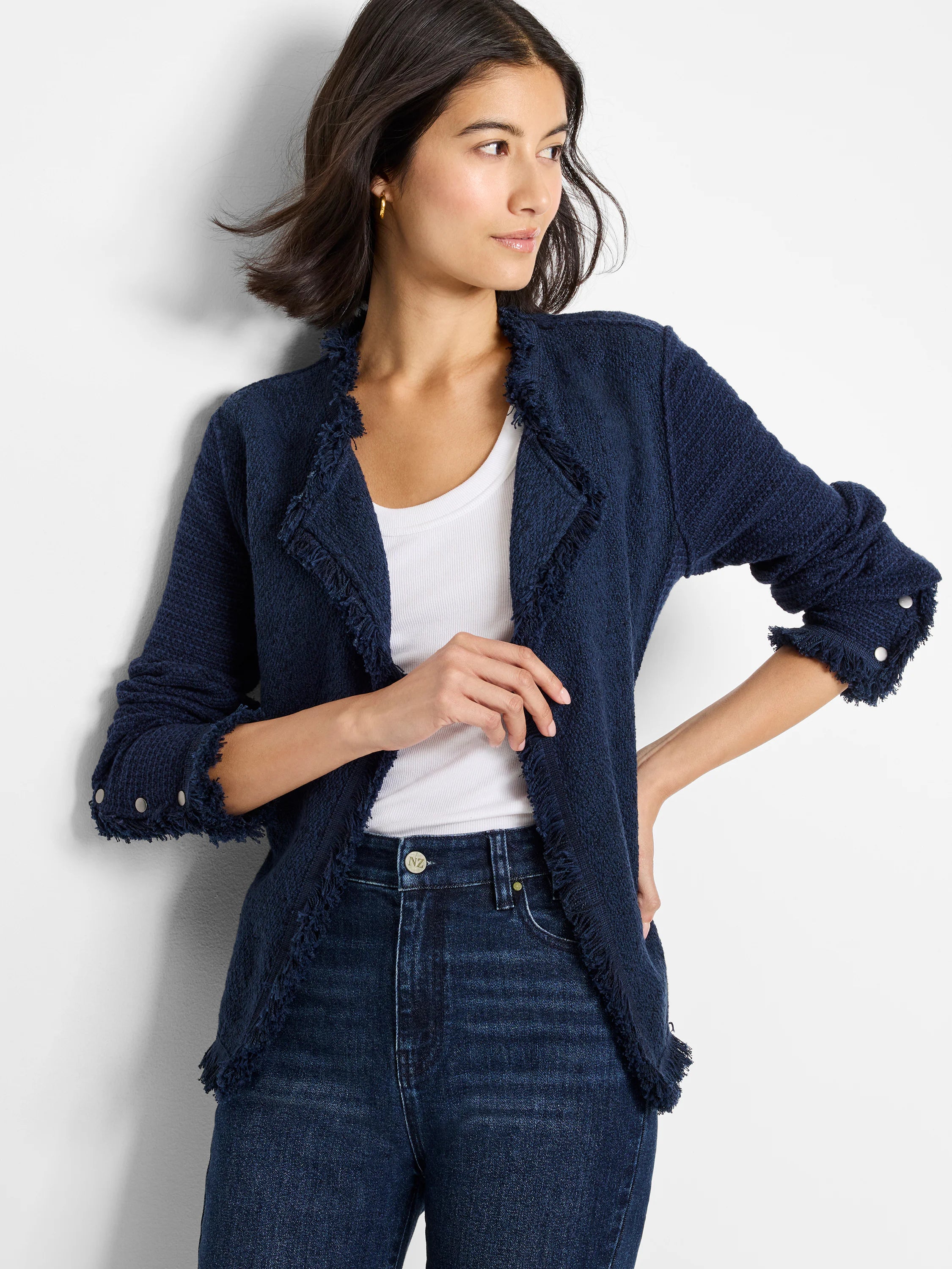 Navy blue textured knit jacket with fringe trim on collar, open front, and cuffs. Features silver buttons on gathered cuffs.