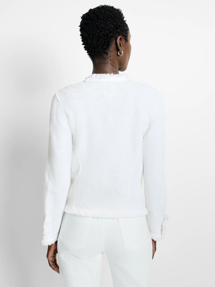 White textured knit jacket with fringe trim at the neckline, hem, and sleeve cuffs.