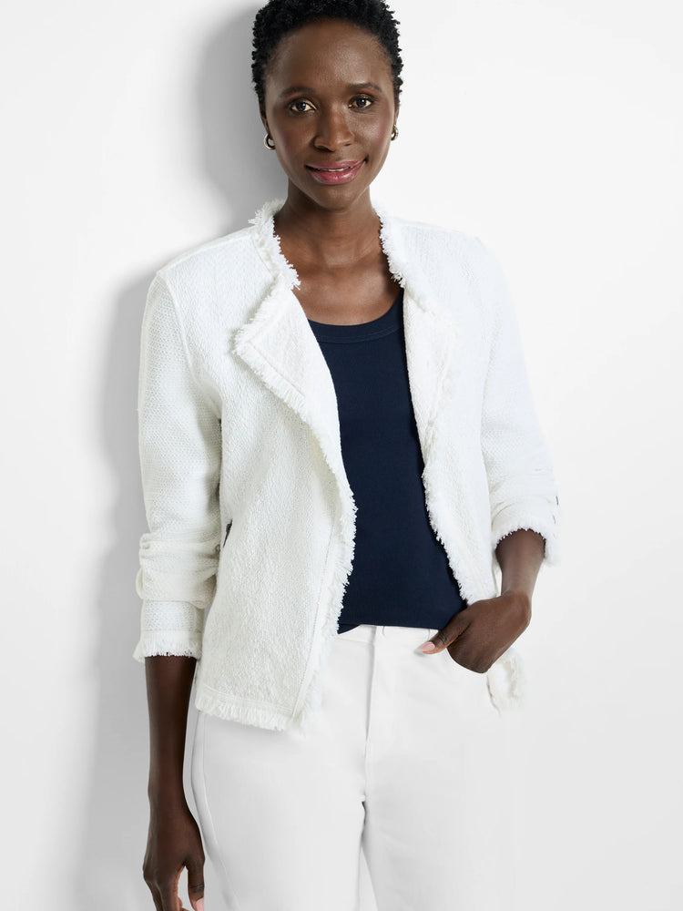 White knit jacket with fringe along the collar, front opening, and cuffs.