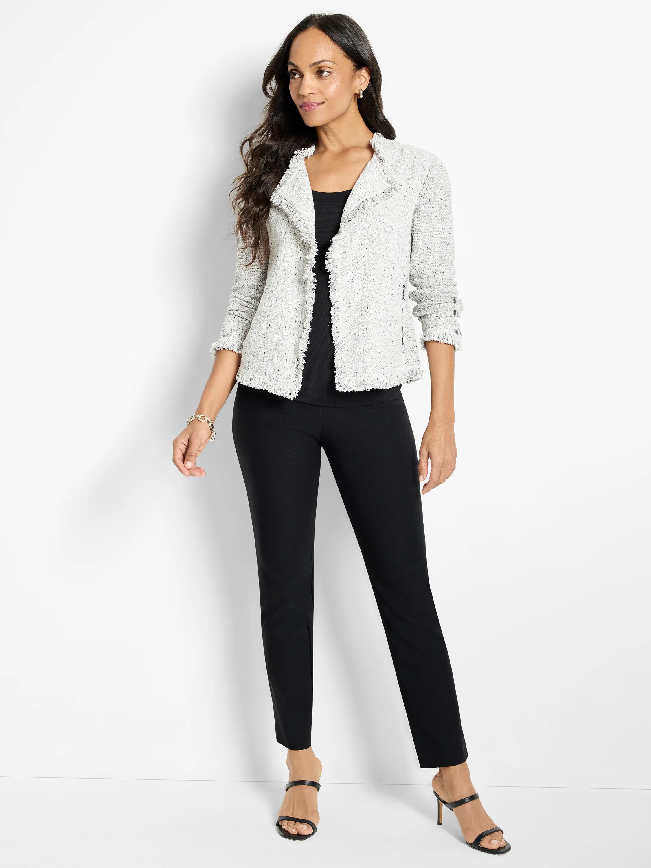 Pale grey speckled knit jacket with fringe trim on collar, front opening, hem, and 3/4 cuffs.