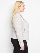 Light grey speckled knit jacket with fringe along the open front, hem, and cuffs. Features a zipper pocket.