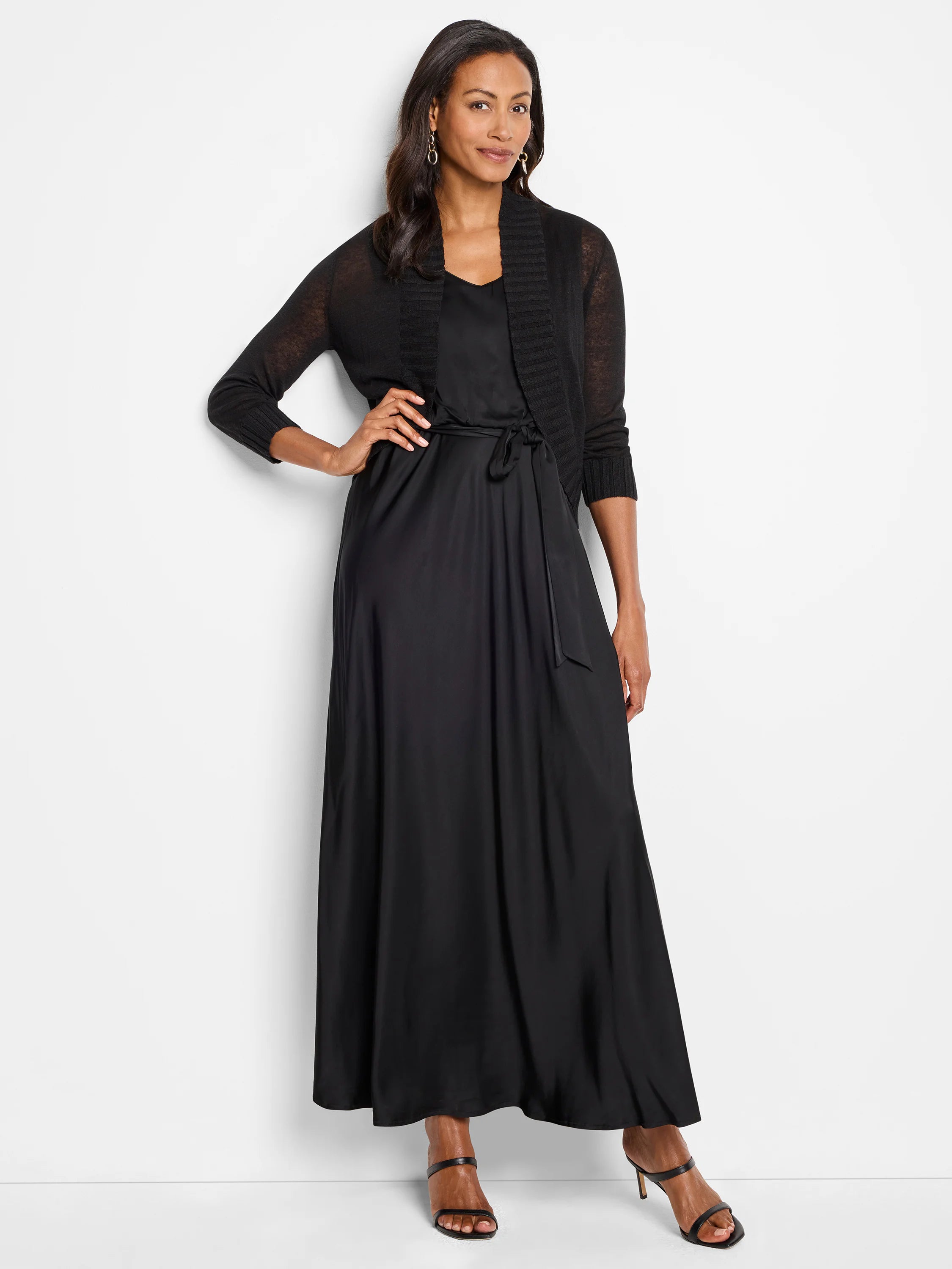 Black bolero cardigan with an open front and 3/4 length sleeves, ribbed details on the cuffs and collar.