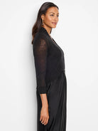 Black bolero cardigan, 3/4 sheer sleeves, open front, ribbed cuffs & hem.