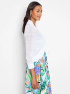 White, lightweight, sheer knit bolero cardigan with elbow-length sleeves and ribbed cuffs.