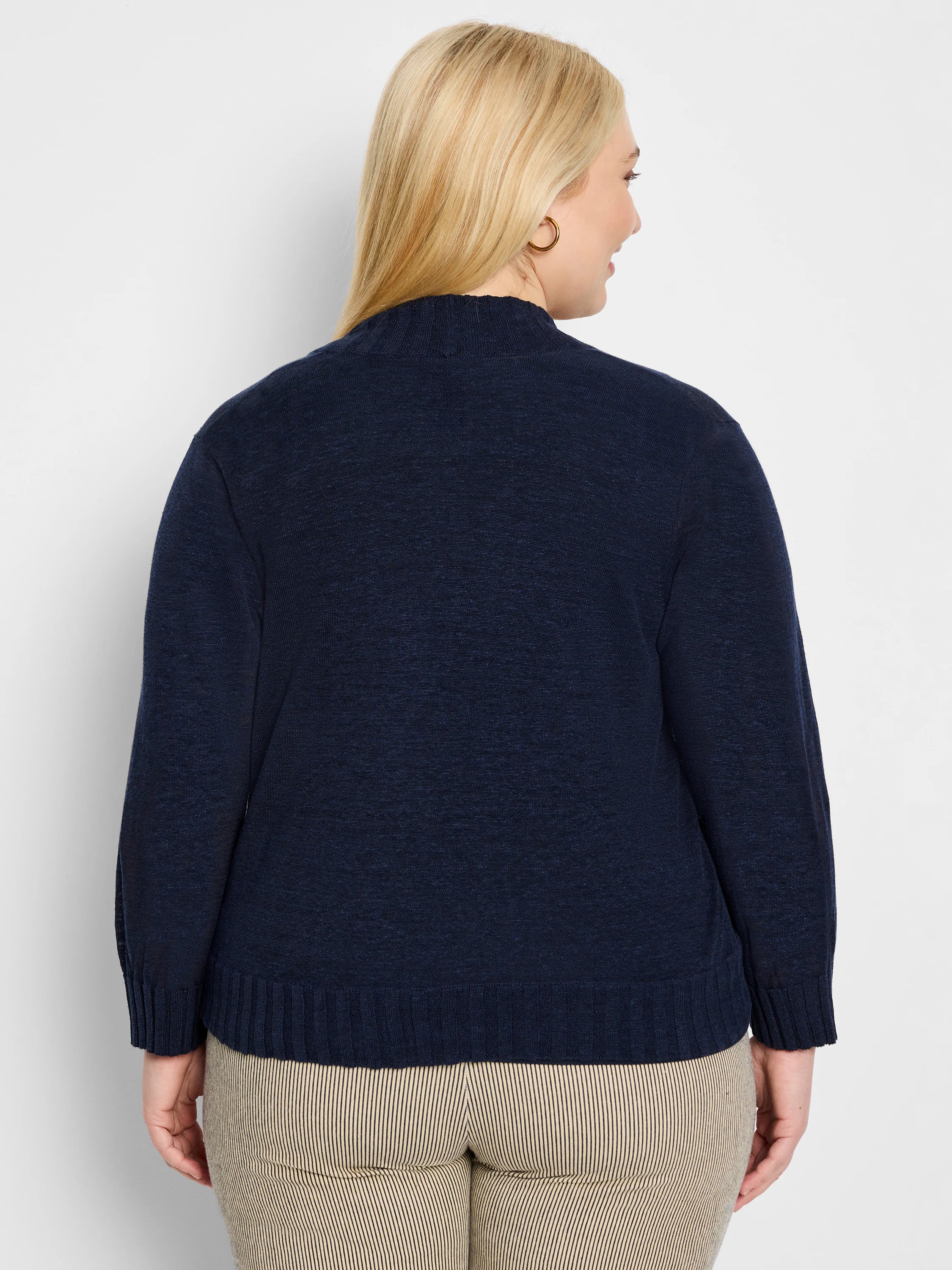 Deep navy blue textured knit bolero cardigan, mock neck, ribbed cuffs and hem, back view on model.
