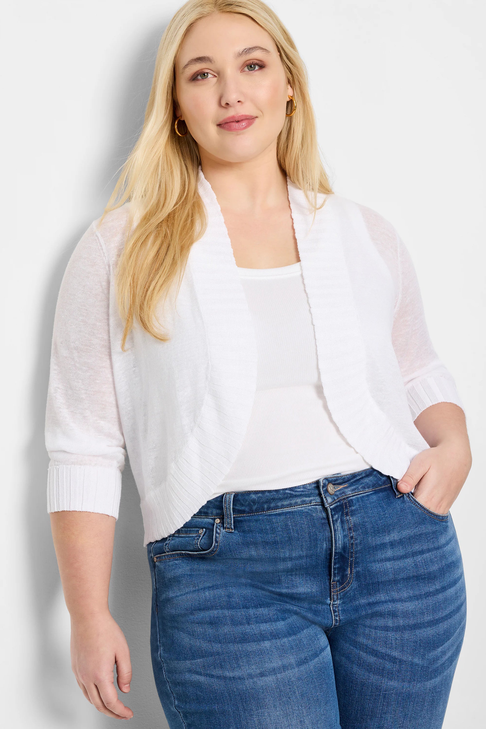 White lightweight knit bolero cardigan, open front, 3/4 sleeves with ribbed cuffs and collar.