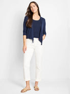 Navy blue open-front cardigan with a draped front and 3/4 ribbed sleeves. Paired with a matching navy top.