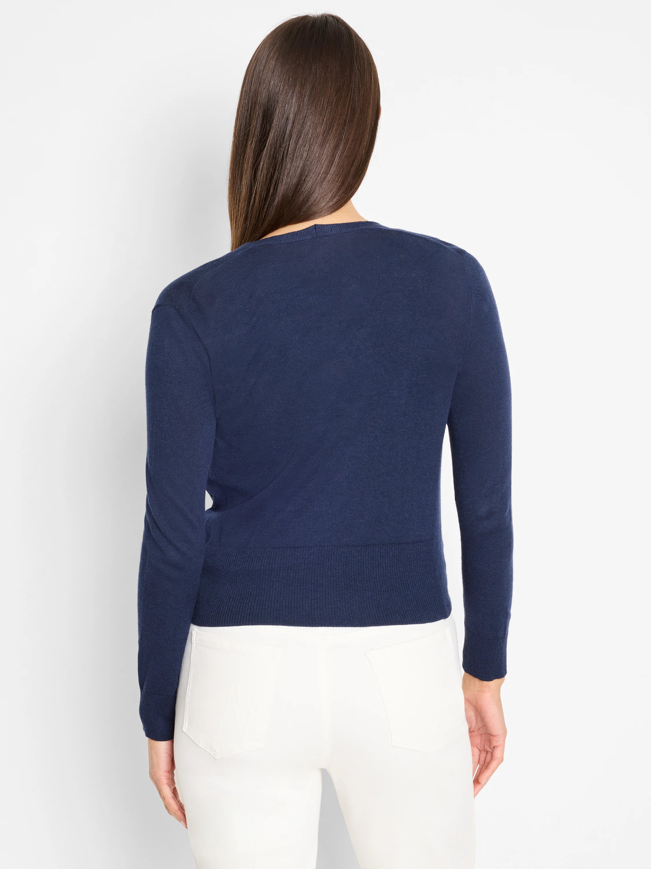 Navy blue long-sleeved knit cardigan with ribbed cuffs and hem, shown from the back.