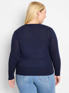 Navy blue fine-knit long-sleeve cardigan with ribbed cuffs and hem, shown from the back.