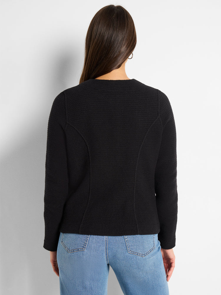 A fitted black textured knit jacket features subtle shaping seams visible on the back.
