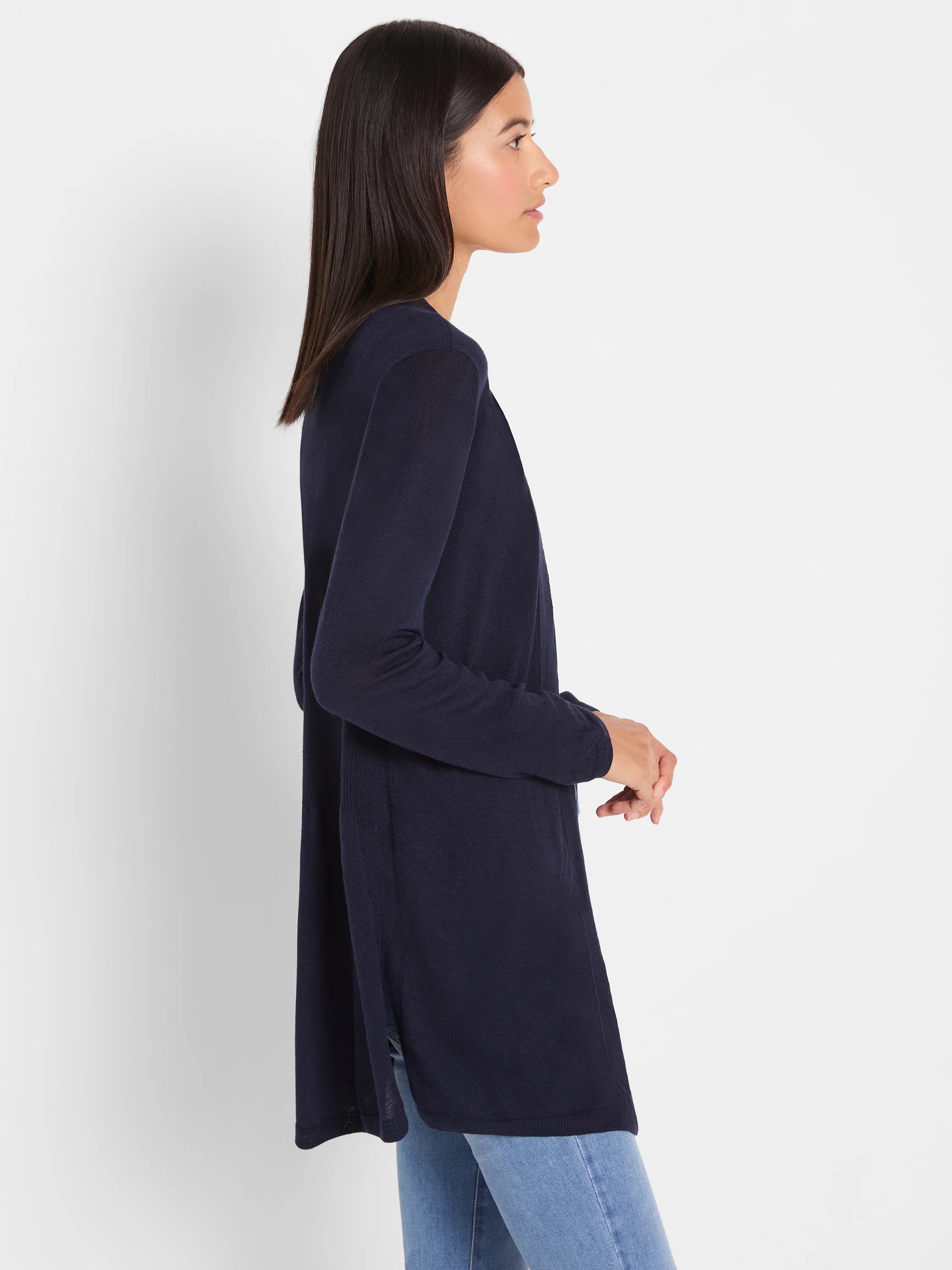 Navy blue, mid-thigh length open-front cardigan with long sleeves and side slits, worn by model.