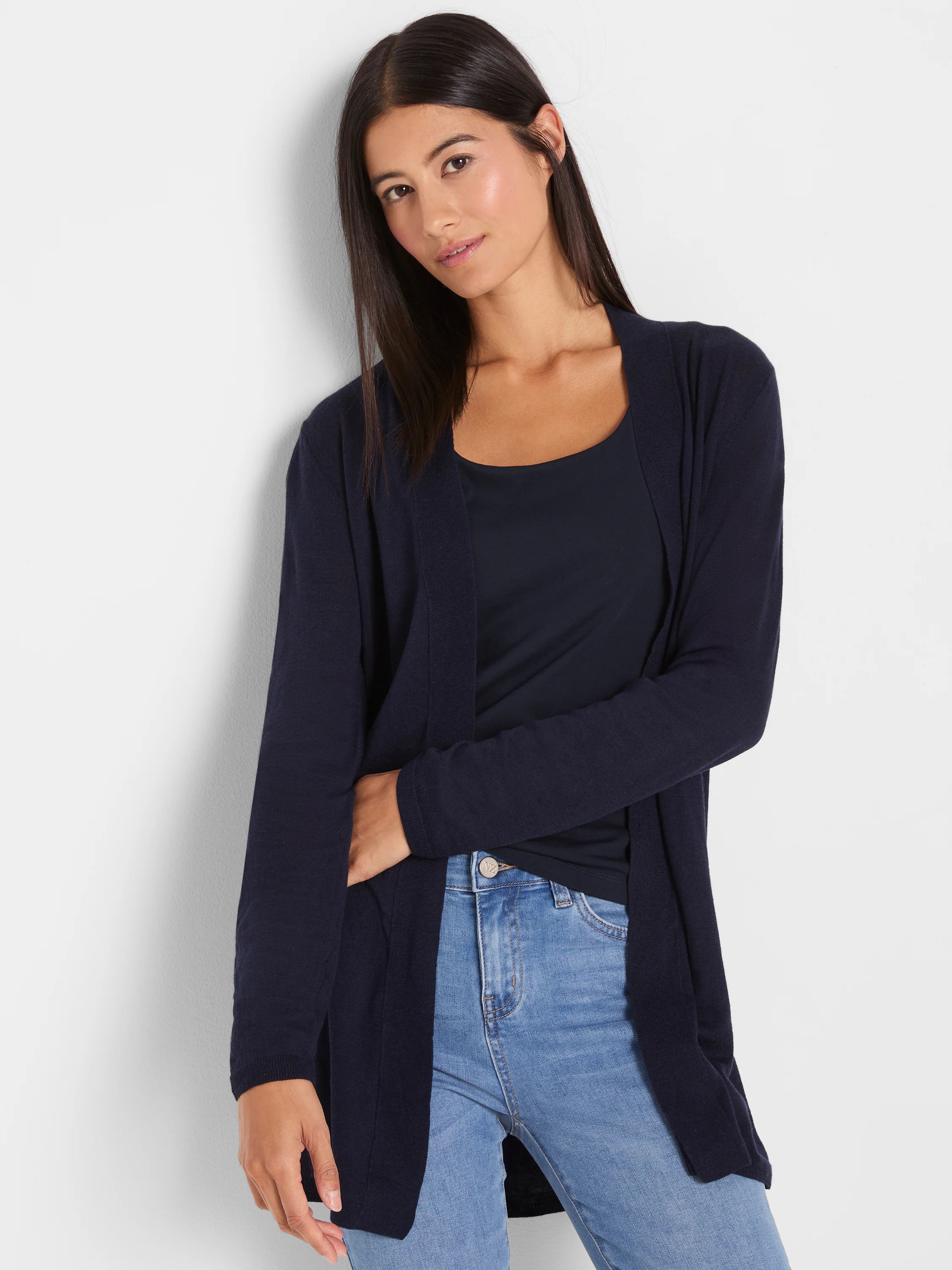 Navy blue, open-front cardigan with long sleeves. Smooth, fine knit texture extending to hips.