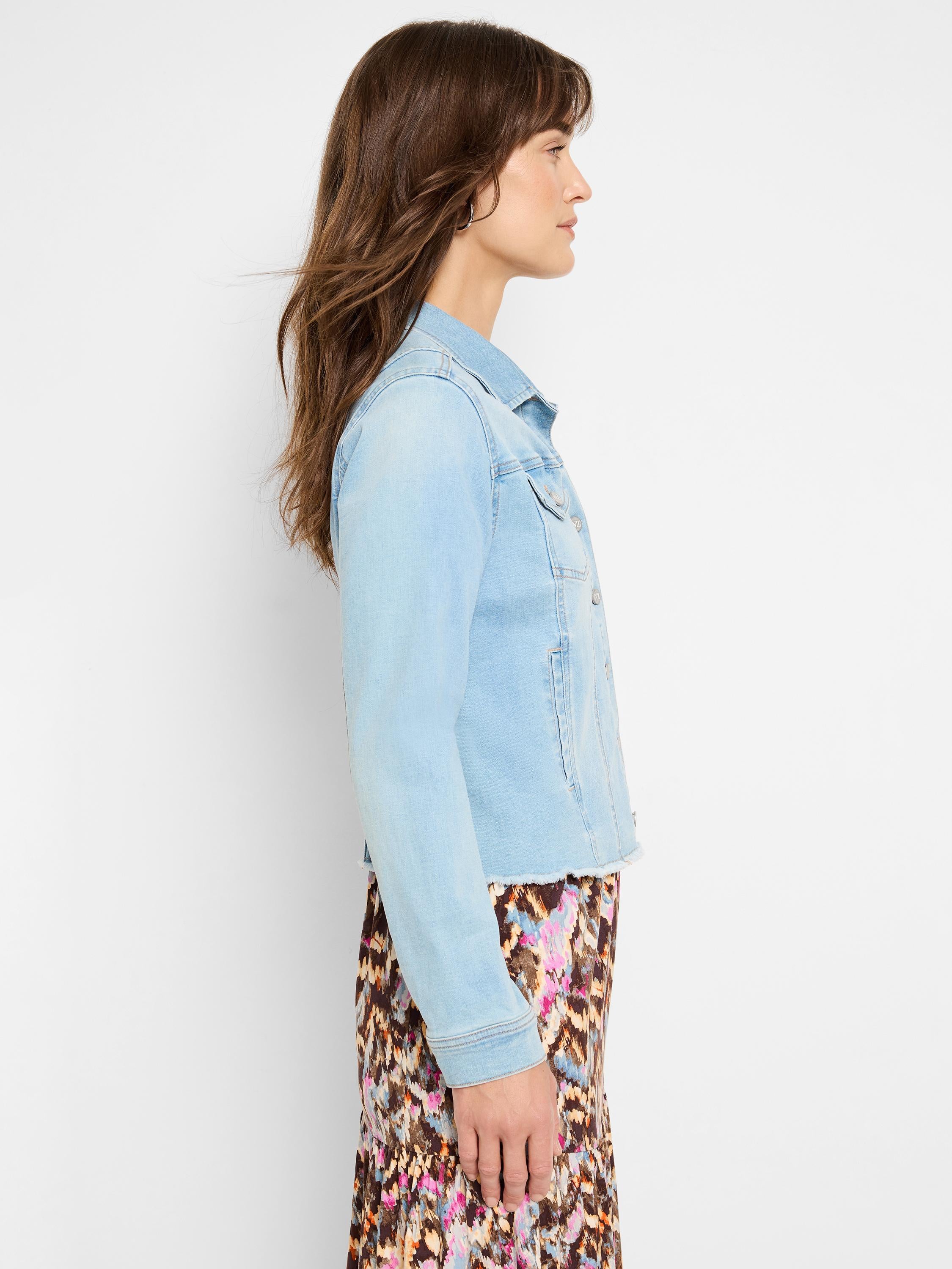 A fitted light blue wash denim jacket featuring classic chest pockets and a distressed, raw cropped hem.