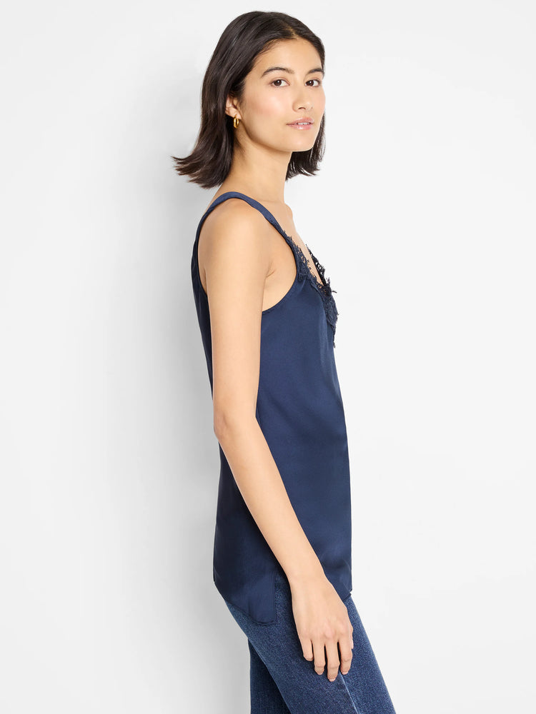 Navy blue cami tank with black lace detail at neckline. Side view.