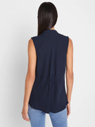 Navy blue sleeveless top with a banded collar and gathering detail on the lower back, shown from behind.