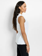 White sleeveless top with a high pointed collar and a relaxed, flowing fit.