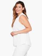 White sleeveless top, V-neckline.  Solid color, simple design.