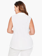 White sleeveless top, collared neckline, A-line shape.  Rear view.