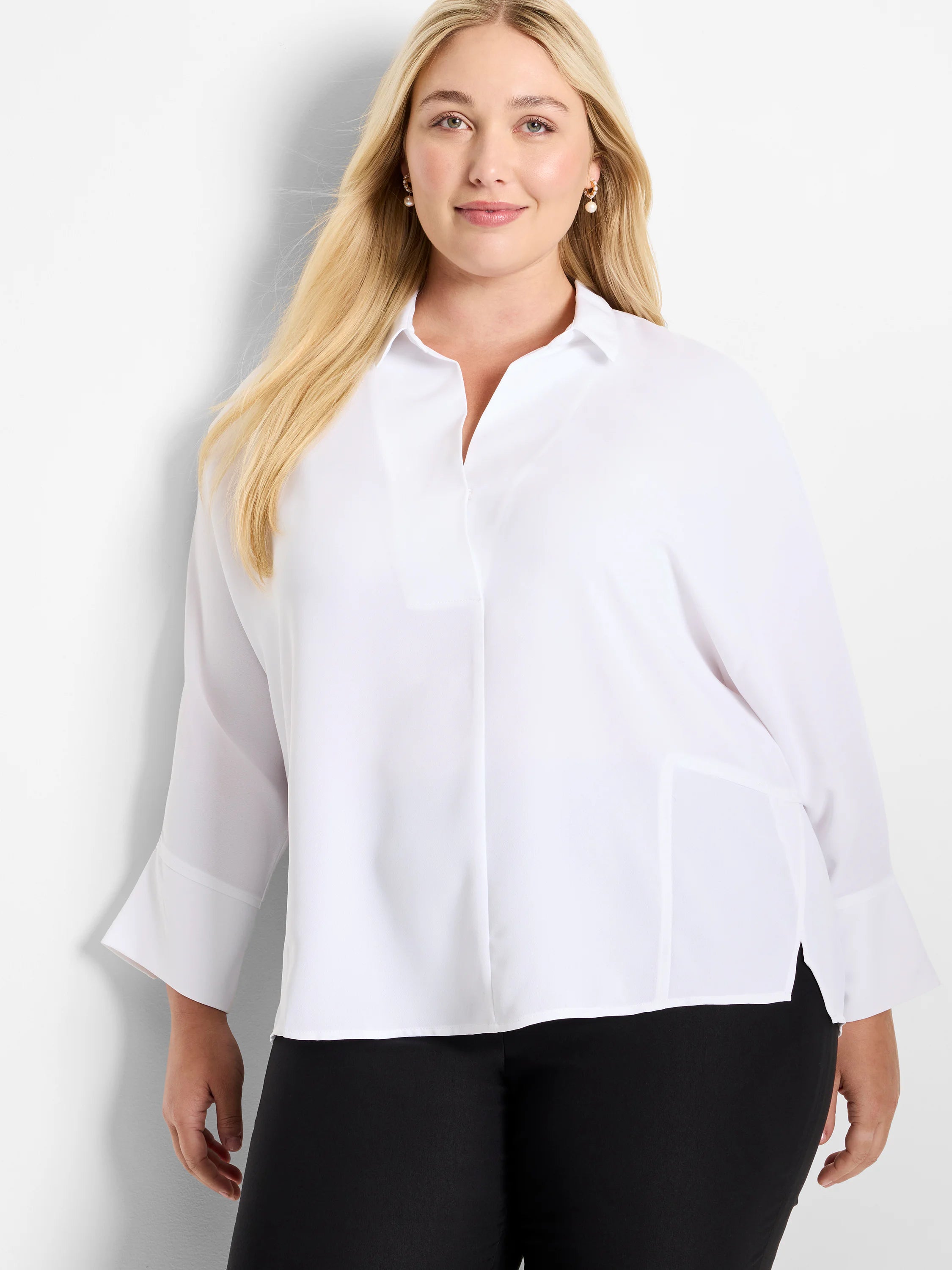 White collared V-neck blouse with 3/4 wide sleeves, side slits, and a relaxed fit.