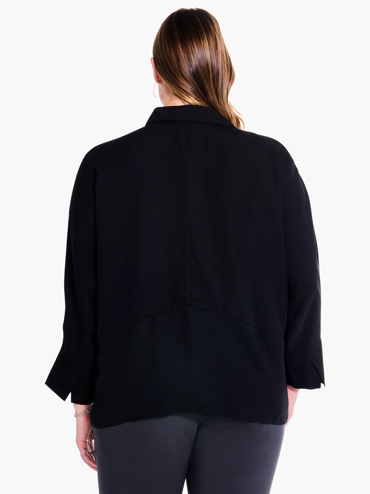 Here's alt text for the image:
Black collared blouse, three-quarter sleeves, seen from the back.