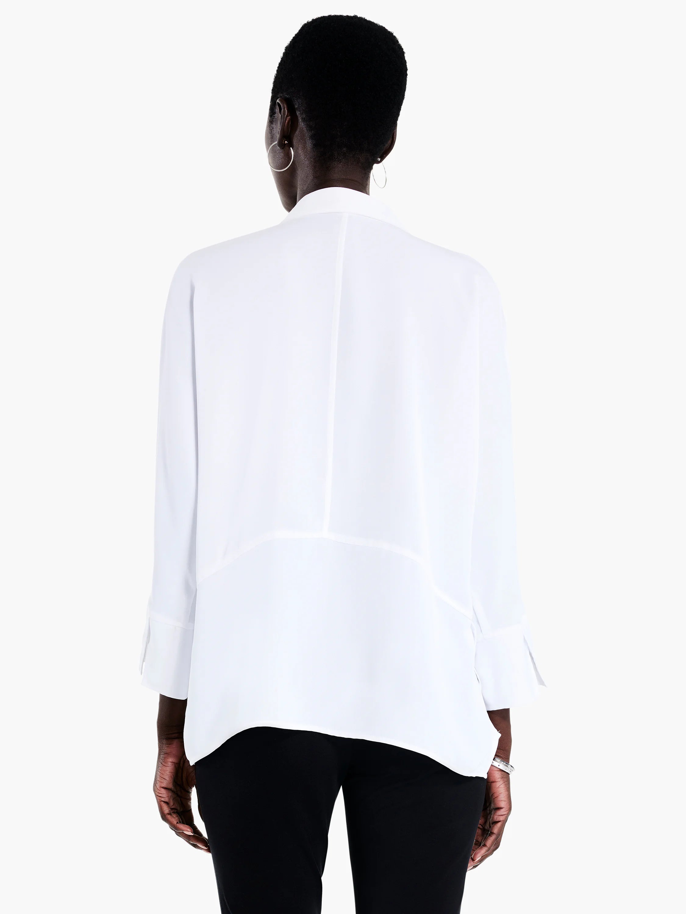 Here's alt text that meets the requirements:
"White, long-sleeve blouse, asymmetrical hemline, shown from the back.