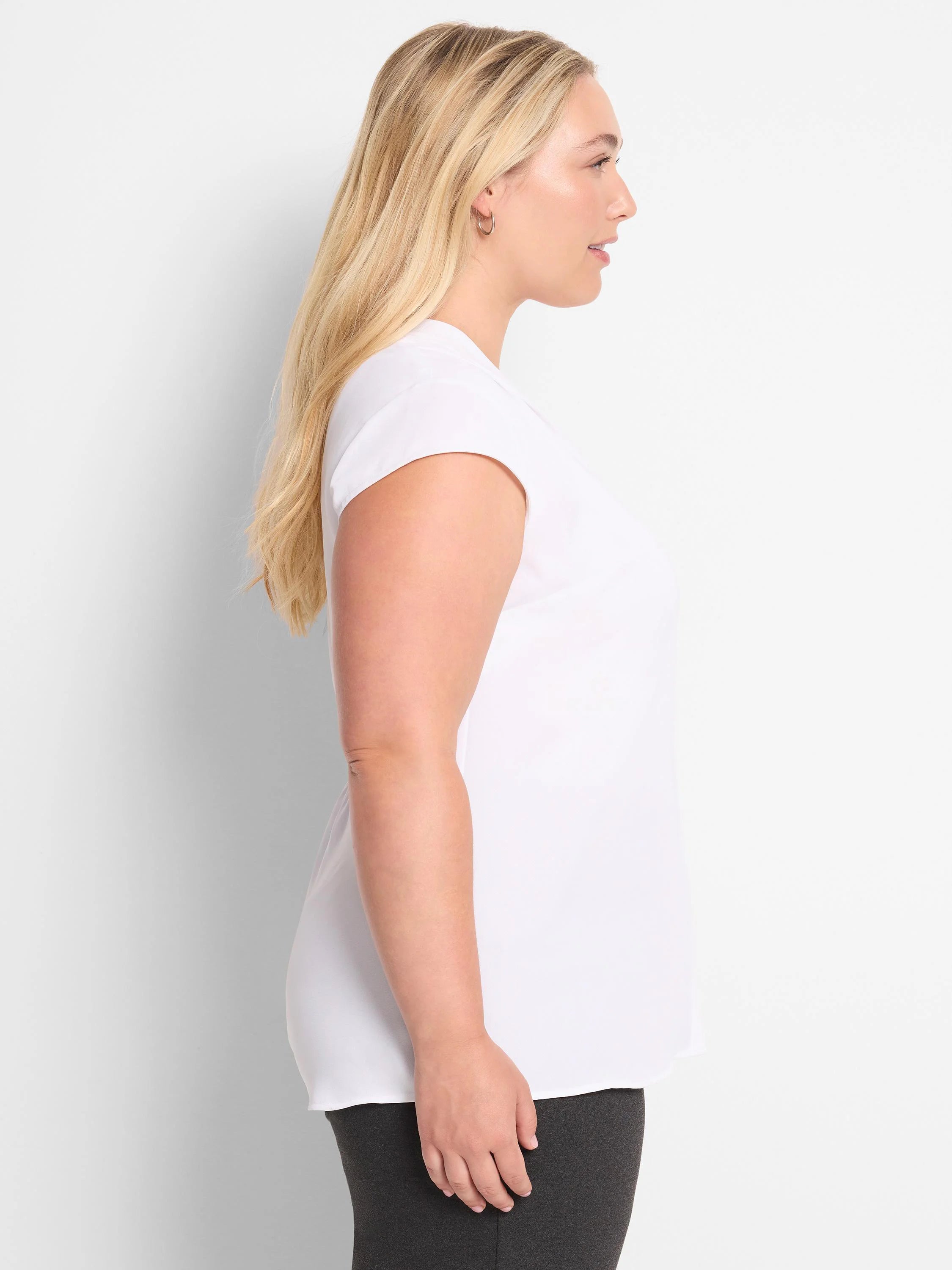 White cap sleeve top, loose fit, untucked.