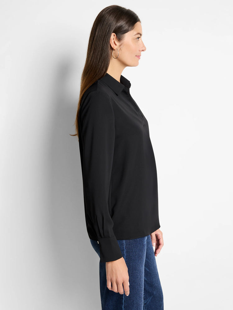 Black popover shirt with a pointed collar, V-neck placket, and long sleeves with buttoned cuffs.