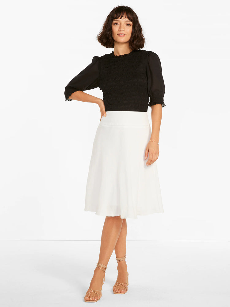 White A-line midi skirt with a wide, flat waistband and a smooth, flowing fabric.