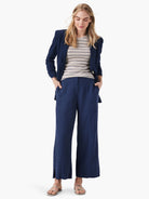 Textured navy wide-leg crop pants with center seams and small side slits at the hem.