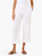 White, wide-leg, cropped pants with a flat front and stitched vertical seams.